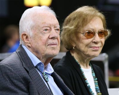 Former President Jimmy Carter, left, and first lady Rosalynn Carter look on during an NFL game between the Atlanta Falcons and Cincinnati Bengals on Sept. 30, 2018, in Atlanta.  (Curtis Compton/The Atlanta Journal-Constitution/TNS)