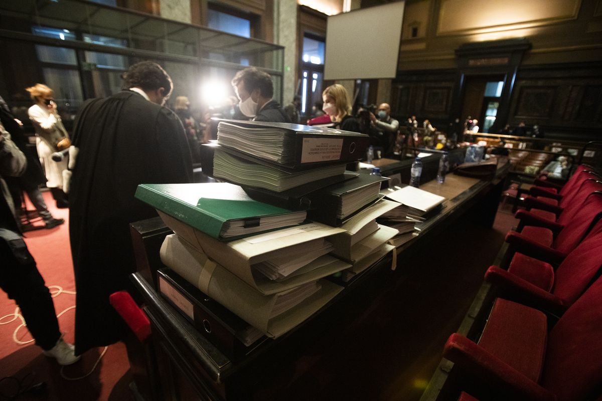 Stacks of documents are placed on a table at the start of a hearing, European Commission vs AstraZeneca, at the main courthouse in Brussels, Wednesday, May 26, 2021. The European Union took on vaccine producer AstraZeneca in a Brussels court on Wednesday with the urgent demand that the company needs to make an immediate delivery of COVID-19 shots the 27-nation bloc insists were already due.  (Virginia Mayo)