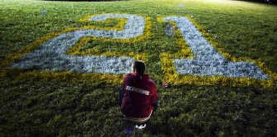 
Associated Press The Washington Redskins and their fans honored their slain teammate, Sean Taylor, whose uniform No. 21 was evident on their field and helmets.
 (Associated Press / The Spokesman-Review)