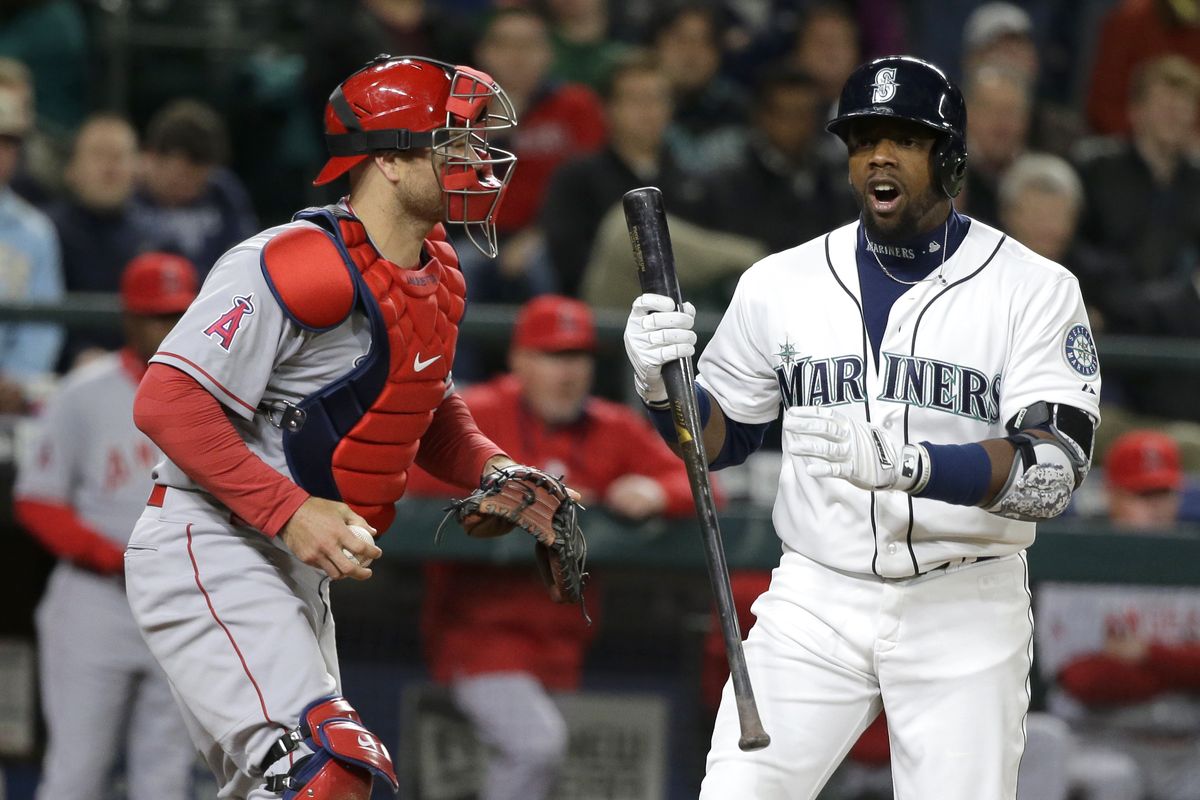 Seattle’s Rickie Weeks, right, reacts to being called out on strikes during the eighth inning Wednesday. (Associated Press)