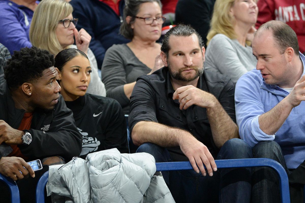 Former Gonzaga players, left to right, Ira Brown, Shaniqua Nilles and Zach Gourde listen to Richard Fox during the GU men’s win over Santa Clara earlier this month. (Dan Pelle / The Spokesman-Review)