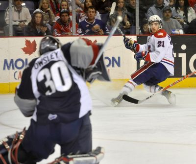 Chiefs Anthony Bardaro watches Tri-City goalie stop his first period shot on Jan. 29, 2011, in the Spokane Arena. (Dan Pelle / The Spokesman-Review)