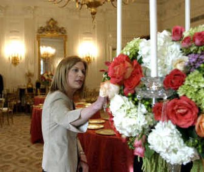 
New White House social secretary Lea Berman checks details before a dinner in the State Dining Room. Her position is one of the most prestigious and influential in the East Wing. She works next to first lady Laura Bush, overseeing all aspects of entertaining in the executive mansion.
 (Washington Post / The Spokesman-Review)