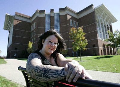 
Librarian Colleen Harris shows off a small portion of her body art outside the William T. Young Library where she works on the University of Kentucky campus in Lexington, Ky. 
 (Associated Press / The Spokesman-Review)