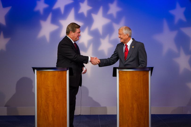 Idaho Congressman Mike Simpson, left, shakes hands with Democratic challenger Richard Stallings, right, at the 