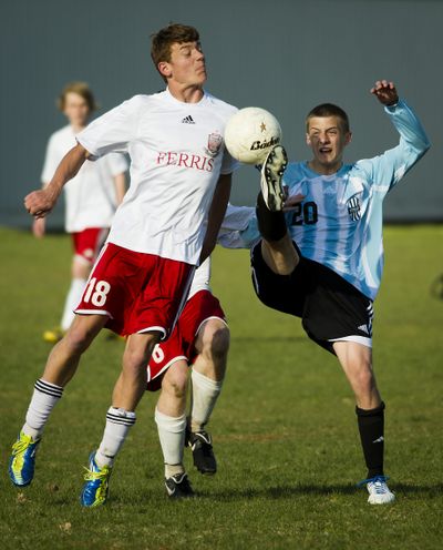 BATTLE FOR THE TOP: Terry Cox of Ferris, left, and Brian Choate of Central Valley squared off Wednesday afternoon as visiting CV won 1-0 in a shootout to tie the Saxons for second place in the Greater Spokane League. Both teams are one game behind the first-place Mead Panthers. Story, Page B4 (Colin Mulvany)