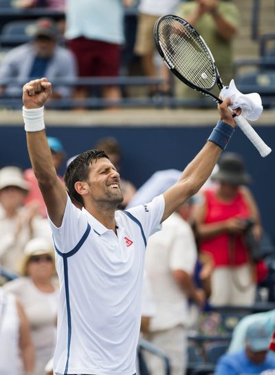 Serbia’s Novak Djokovic celebrates after defeating Gilles Muller of Luxembourg. (Nathan Denette / Associated Press)