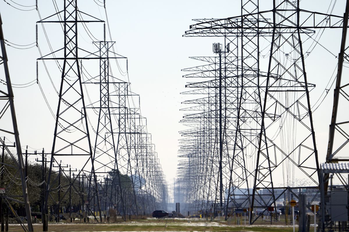 FILE - This Tuesday, Feb. 16, 2021, file photo shows power lines in Houston. When an unusually heavy winter storm blanketed much of Texas with snow, knocking out electricity to millions of homes and leaving many struggling to find clean water, one sector of the population was particularly vulnerable: inmates in Houston at the state