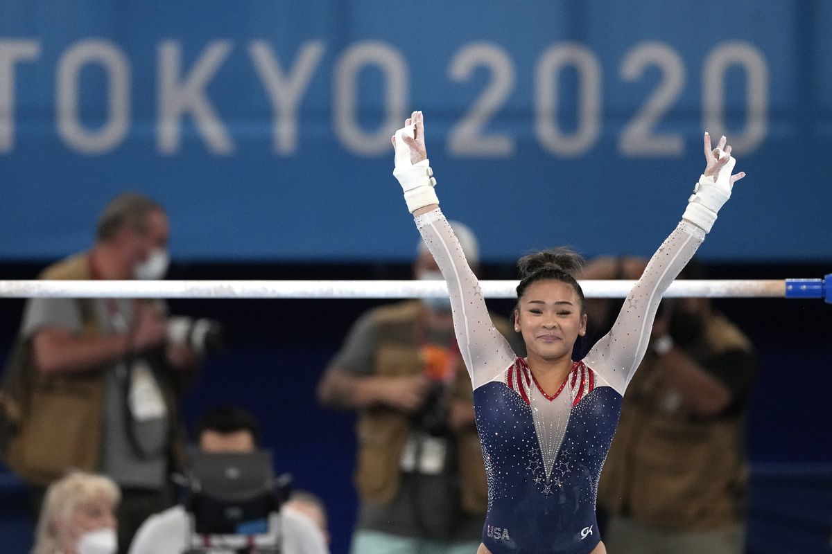Sunisa Lee, of the United States, finishes on the uneven bars during the artistic gymnastics women