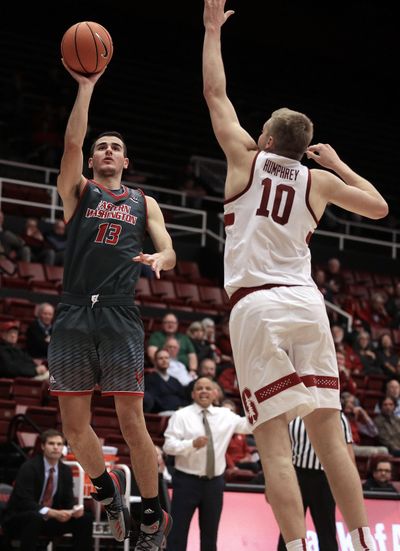 Eastern Washington’s Luka Vulikic, left, shoots against Stanford’s Michael Humphrey  on Nov. 14, 2017, in Stanford, California. Eastern Washington won 67-61. (Ben Margot / AP)