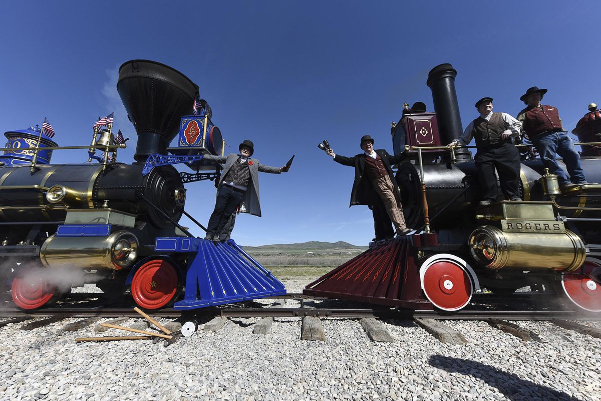 Doug Foxley, left, and Spencer Stokes recreate a historic photo on Friday May 10, 2019, in celebration of the 150th anniversary of the completion of the transcontinental railroad at Promontory Summit where the two rails met back on May 10, 1869. (Francisco Kjolseth/The Salt Lake Tribune / Associated Press)