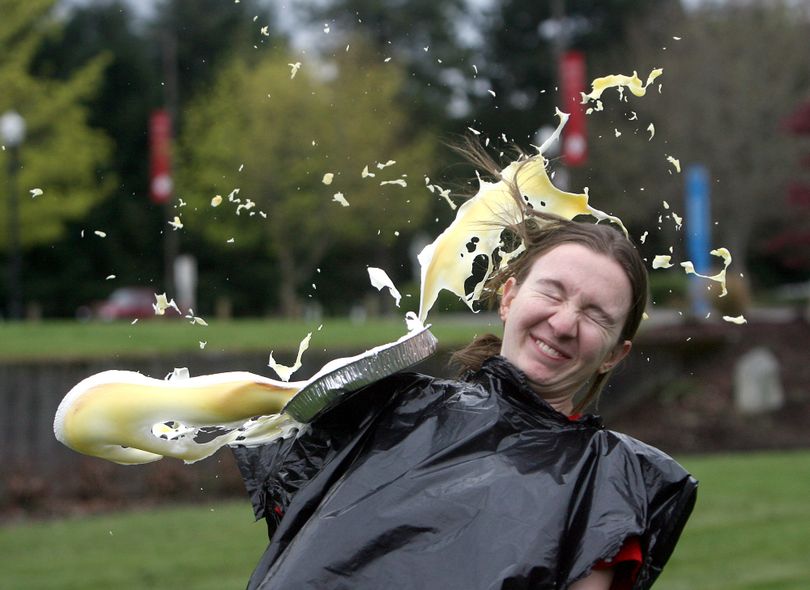 Saint Martin's University civil engineering student Jennifer Hatfield volunteers as a practice target before a group of department professors took the stage for a pie tossing fundraiser for Haiti earthquake relief Tuesday, April 20, 2010 on the Lacey, Wash. campus. The event, which brought in $2,300, was organized by the university's engineering department, which plans a trip to Haiti with the American Society of Civil Engineers (ASCE), the American Society of Mechanical Engineers (ASME), and Engineers Without Borders (EWB). They will work on service projects to help those affected by the recent earthquake. (Steve Bloom / The Olympian)