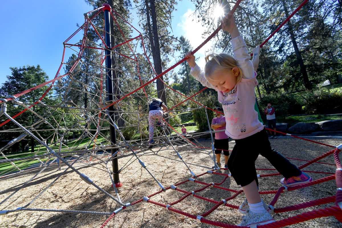Sage Green climbs on the new soft rope play structure in lower Manito Park. The pavilion-shaped structure and its accompanying features are intended to challenge children and spark their imaginations. A German-based company called Berliner is the manufacturer. (Colin Mulvany / The Spokesman-Review)