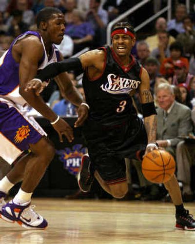 
Philadelphia's Allen Iverson, right, drives on Joe Johnson of the Phoenix Suns during the first quarter Wednesday night. 
 (Associated Press / The Spokesman-Review)