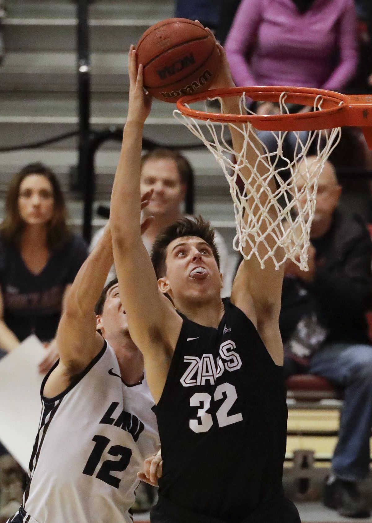 Gonzaga forward Zach Collins, right, shoots past Loyola Marymount guard Steven Haney during the second half of an NCAA college basketball game in Los Angeles, Thursday, Feb. 9, 2017. Gonzaga won 90-60. (Chris Carlson / Associated Press)