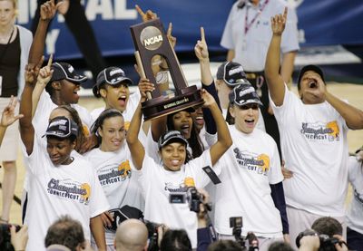 Connecticut players celebrate regional final win over Arizona State. (Associated Press / The Spokesman-Review)