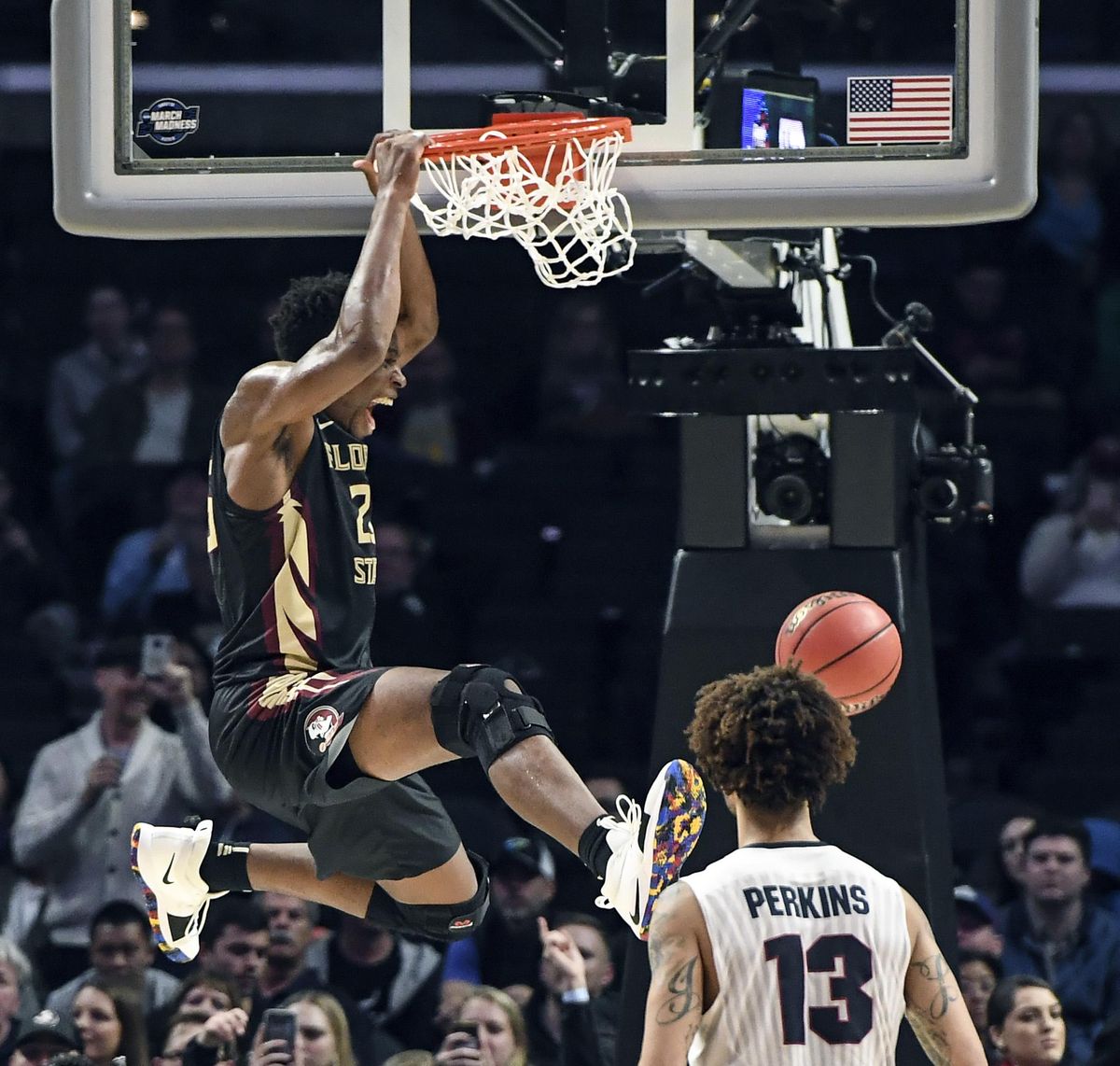 Florida State forward Mfiondu Kabengele slams dunks against Gonzaga guard Josh Perkins late in the Sweet 16 game, Thursday, March 22, 2018, at the Staples Center in Los Angeles. (Dan Pelle / The Spokesman-Review)