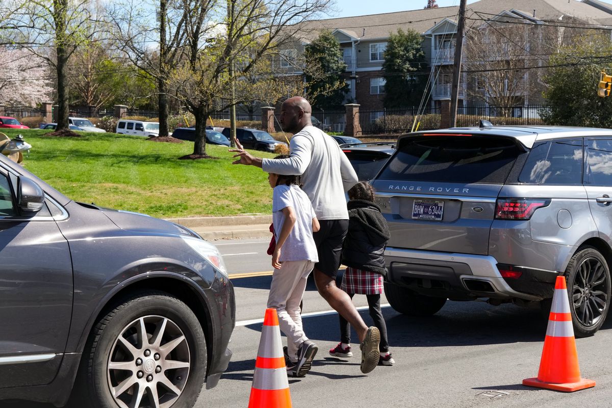 The scene outside a nearby church that had been set up as a reunification area for parents to meet their children following a shooting at a private Christian school in Nashville on Monday, March 27, 2023. A heavily armed woman entered the Convent School on Monday morning and fatally shot three children and three staff members before she was shot and killed by the police, a spokesman for the Metropolitan Nashville Police Department said.   (Desiree Rios/The New York Times)