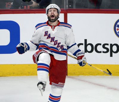 New York Rangers right wing Martin St. Louis celebrates after scoring the opening goal against the Montreal Canadiens. (Associated Press)