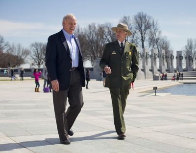 In this March 23, 2015 photo, National Park Service Director Jonathan Jarvis, right, and the head of the National Park Foundation Dan Wenk walk at the World War II Memorial on the National Mall in Washington. (Pablo Martinez Monsivais / Associated Press)
