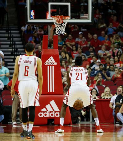 Houston Rockets forward Chinanu Onuaku (21) shoots his free throws underhanded as guard Tyler Ennis (6) watches against the Phoenix Suns in the second half of an NBA basketball game on Monday, Dec. 26, 2016 in Houston. (Bob Levey / Associated Press)