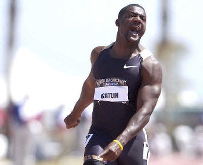 
Justin Gatlin lets out a victory yell after winning the men's 100-meter dash on Saturday at the U.S. championships in Carson, Calif.
 (Associated Press / The Spokesman-Review)