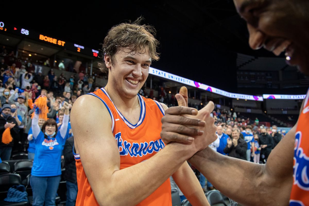 Mt. Spokane grad Tyson Degenhart celebrates with teammate Abu Kigab, right, after Boise State beat Washington State in the nonconference game at the Spokane Arena on Dec. 22, 2021. (Jesse Tinsley/The Spokesman-Review)