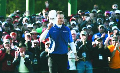 
Zach Johnson tips his hat to the gallery after finishing the 18th hole during the final round of the 2007 Masters golf tournament at Augusta National Golf Club.
 (Associated Press / The Spokesman-Review)