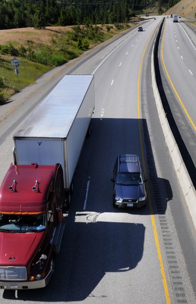 Vehicles head east on Interstate 90 near Coeur d’Alene on Wednesday. Idaho is preparing to launch a new highway cost-allocation study.  The Idaho Transportation Department  director killed the last one,  which showed heavy trucks underpay and cars overpay. (Colin Mulvany / The Spokesman-Review)