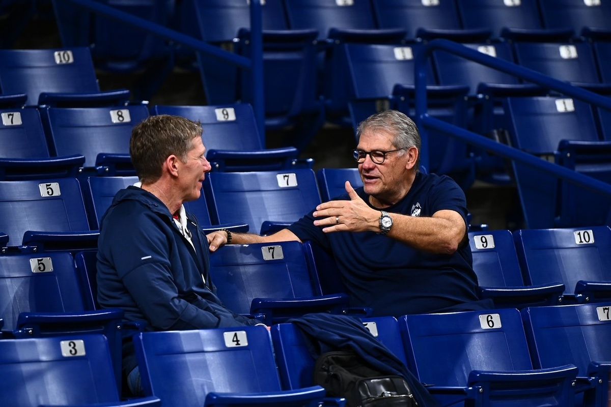 Gonzaga men’s basketball coach Mark Few (left) visits with Connecticut women’s coach Geno Auriemma during the Husies’ practice at McCarthey Athletic Center on Thursday.  (Courtesy/UConn Athletics)