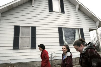 The Spokesman-Review Lisa Biondo, of Windermere Realty, left, along with EPIC Academy members Marcia Dettmann, center, and Danelle Baumgarten-Pickett walk the site recently of what could be their new charter school for children for Asperger’s Syndrome in Hayden. (Kathy Plonka / The Spokesman-Review)