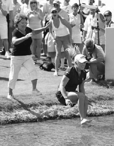 Morgan Pressel, followed by her grandmother, takes the traditional victory leap.
(Associated Press / The Spokesman-Review)