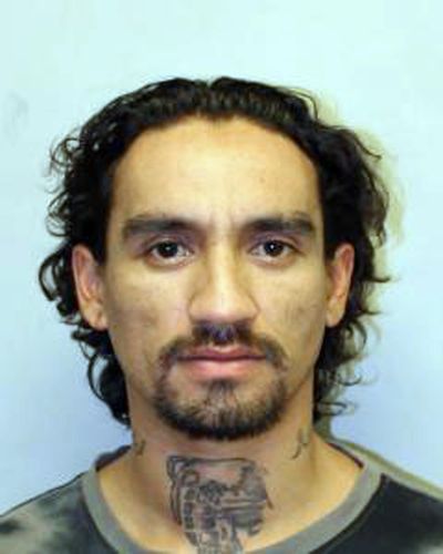 This undated photo provided by the Hawaii Police Department shows Justin Waiki. A police officer on Hawaii’s Big Island died after a shooting during a traffic stop Tuesday, July 17, 2018, and a manhunt is underway for suspect Waiki. (uncredited / AP)
