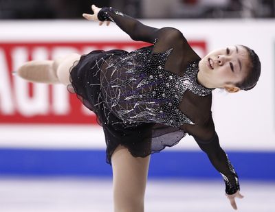 Kim Yu-na, of South Korea, performs her routine in the ladies’ short program Friday night in Los Angeles.  (Associated Press / The Spokesman-Review)