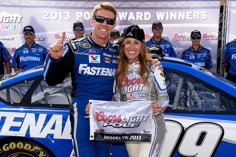 Carl Edwards, driver of the #99 Fastenal Ford, poses with Miss Coors Light Rachel Rupert and the Coors Light Pole award after qualifying for pole position for the NASCAR Sprint Cup Series Quicken Loans 400 at Michigan International Speedway on June 14, 2013 in Brooklyn, Michigan. (Photo Credit: John Harrelson/Getty Images) (John Harrelson / Getty Images North America)