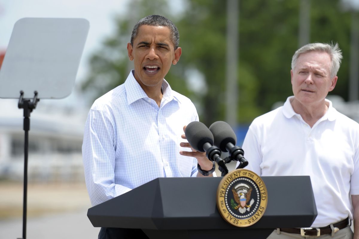 President Barack Obama with Secretary of the Navy Ray Mabus, right, makes a statement at the U.S. Coast Guard Panama City District Office on Saturday.  (Associated Press)