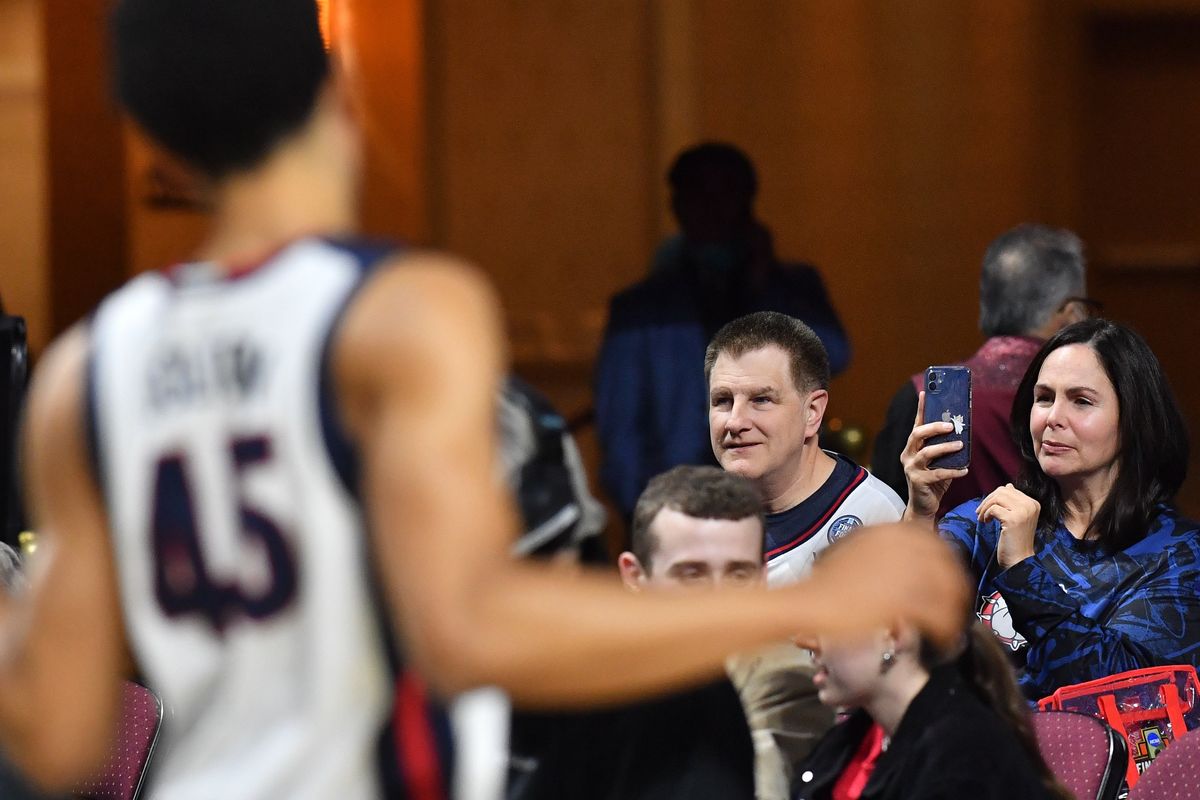 Gonzaga Bulldogs superfan Ed Dzama, left, and his wife Christina Dzama soak up the sights as their favorite team takes the floor during the first half of a WCC Tournament semifinal basketball game against the San Francisco Dons on Monday in Las Vegas.  (Tyler Tjomsland/The Spokesman-Review)