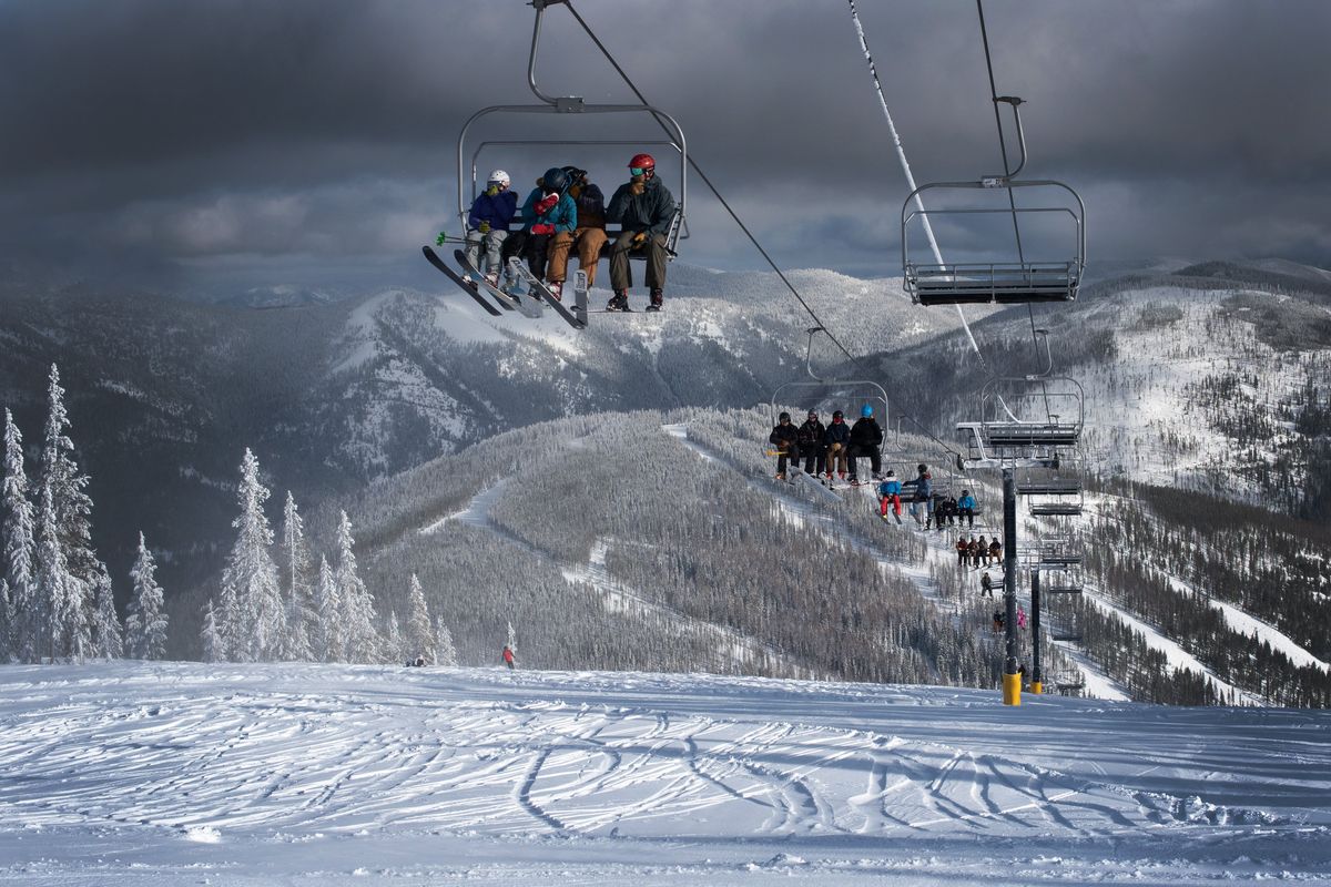 Skiers enjoy the views from the Eagle Peak chairlift at Lookout Pass in this 2022 file photo.  (Eli Francovich/The Spokesman-Review)