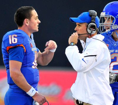 Boise State quarterback Joe Southwick, who finished with a career-high 335 yards passing on Saturday, talks with coach Chris Petersen. (Associated Press)