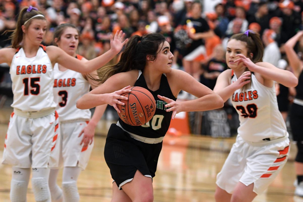 East Valley basketball standout Genesis Wilkinson looks for a shot during a game against West Valley on Friday at West Valley High School. Wilkinson scored 20 to lead the Knights to victory, 53-38. (Colin Mulvany / The Spokesman-Review)