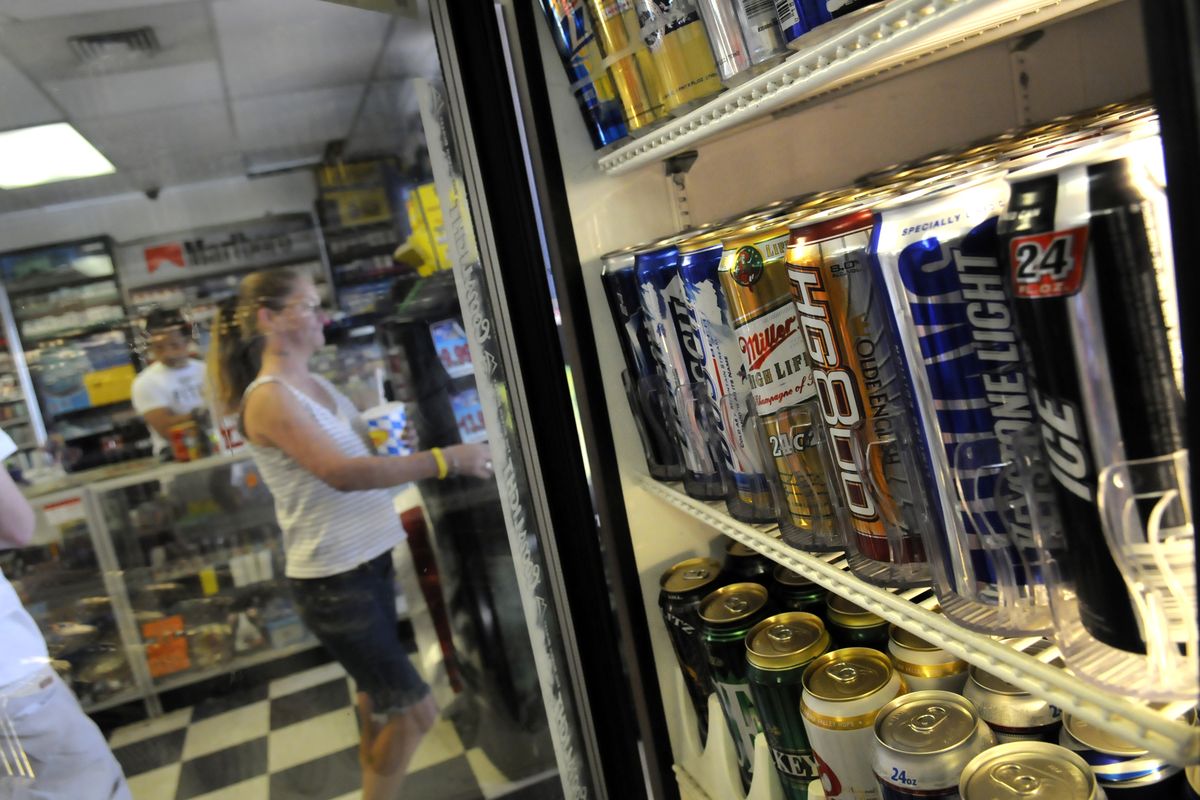 Hai market on East Sprague Avenue  does a brisk business in single can and bottle sales of beers and malt liquors. The city of Spokane is mulling a  voluntary restriction on high-alcohol-content beer sales in that area.  (Jesse Tinsley / The Spokesman-Review)
