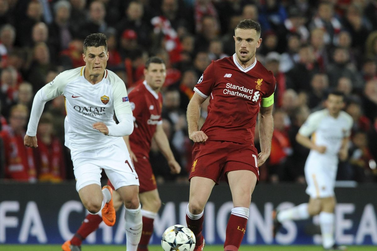 Liverpool’s Jordan Henderson, right, duels for the ball with Roma’s Patrik Schick during the Champions League semifinal, first leg, soccer match between Liverpool and Roma at Anfield Stadium, Liverpool, England, Tuesday, April 24, 2018. (Rui Vieira / Associated Press)