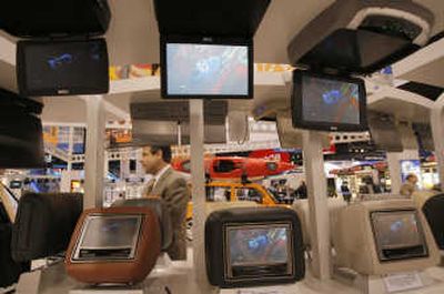 
Car headrest and overhead DVD systems by Audiovox at the International Consumer Electronics Show in Las Vegas. Associated Press
 (Associated Press / The Spokesman-Review)