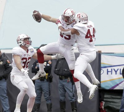 Stanford safety Dallas Lloyd celebrates his interception and touchdown with teammates Kevin Palma (44) and Joey Alfieri (32) during the second half of the Sun Bowl on Friday, Dec. 30, 2016, in El Paso, Texas. (MARK LAMBIE / Associated Press)
