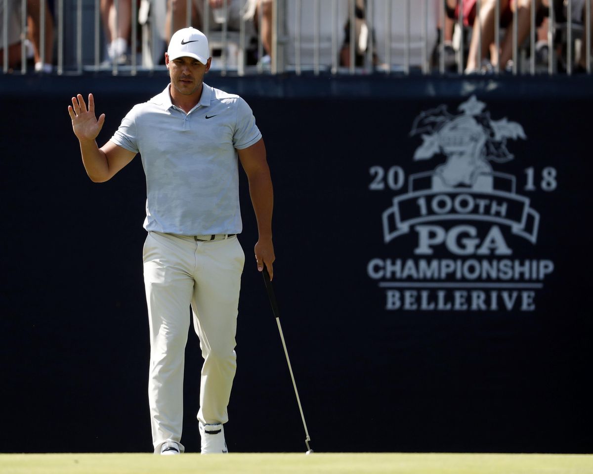 Brooks Koepka waves after making a putt on the ninth hole during the third round of the PGA Championship golf tournament at Bellerive Country Club, Saturday, Aug. 11, 2018, in St. Louis. (Jeff Roberson / AP)