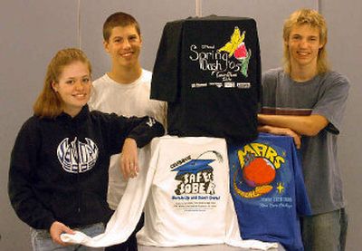 
From left, Laura James, Austin Brown and Chad Carson have designed T-shirts in their commercial art class at CHS. 
 (Jesse Tinsley / The Spokesman-Review)