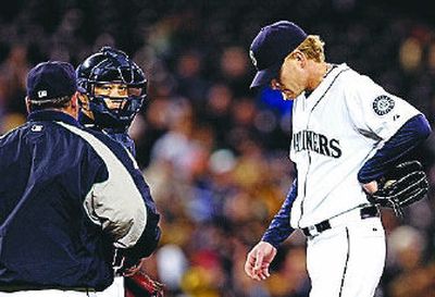 
Seattle starter Jeff Weaver, right, was down in the dumps at Safeco Field.
 (Associated Press / The Spokesman-Review)