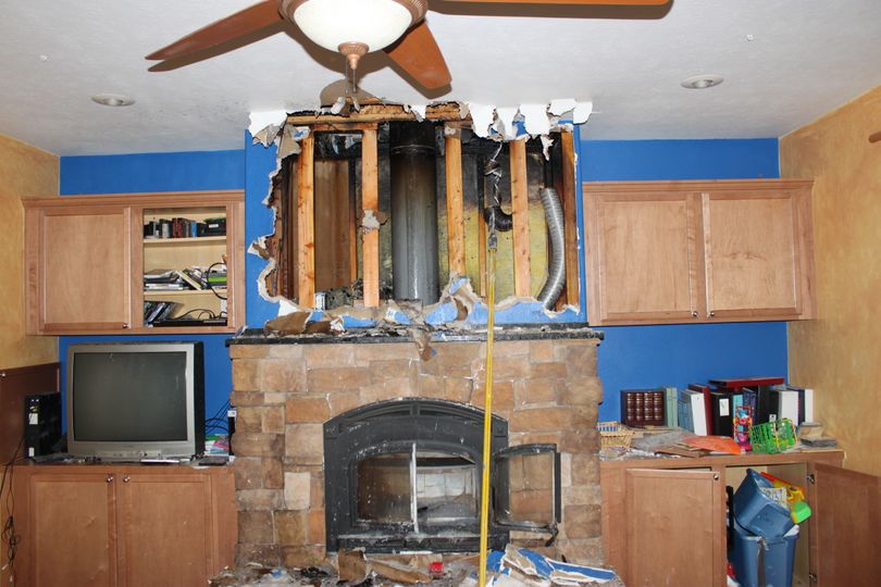 This home in the 15100 block of East Sixth in Spokane Valley was damaged by an attic fire on March 5, 2012. Firefighters had to rip open the wall and roof to put out the fire. Photo courtesy the Spokane Valley Fire Department.  (Photo courtesy the Spokane Valley Fire Department)