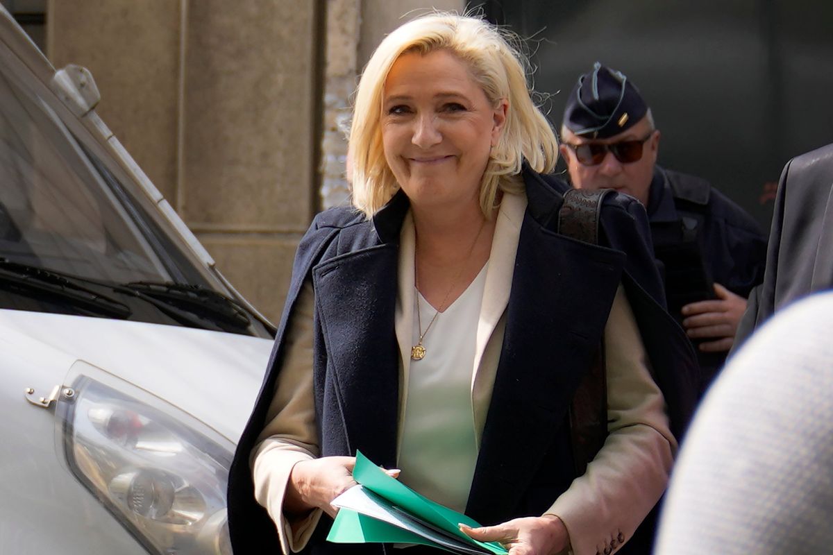 FILE - French far-right candidate Marine Le Pen leaves her campaign headquarters in Paris, Monday, April 11, 2022. French President Emmanuel Macron, the incumbent president with strong pro-European views, and Marine Le Pen, an anti-immigration nationalist, couldn