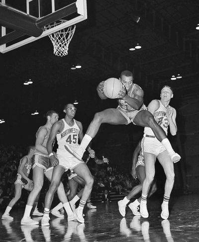 Former UCLA basketball star Fred Slaughter (35), who helped legendary coach John Wooden to the first of his 10 NCAA titles, has died. No cause of death was given. Slaughter was 74. (Larry Stoddard / AP)